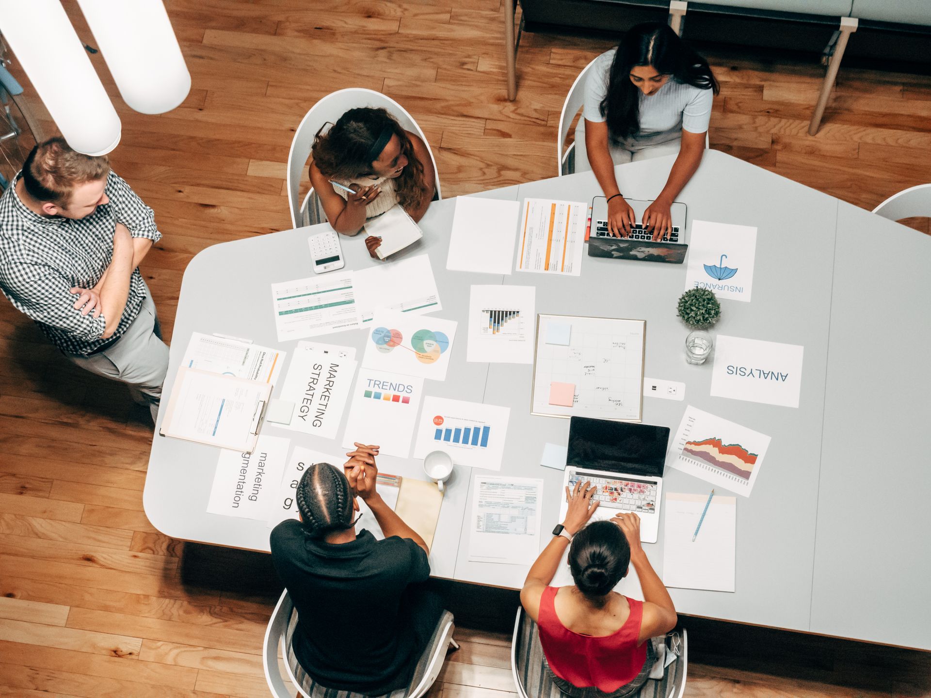 Proofs pinned under studio lamp